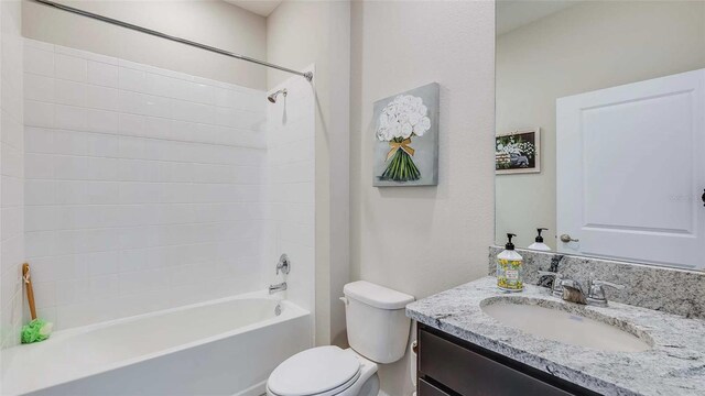 full bathroom with shower / tub combination, toilet, and vanity