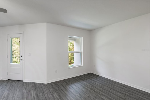 empty room featuring dark wood-type flooring