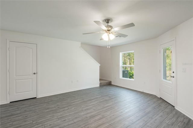 unfurnished room featuring ceiling fan and hardwood / wood-style flooring