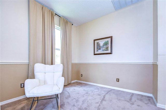 living area with light colored carpet