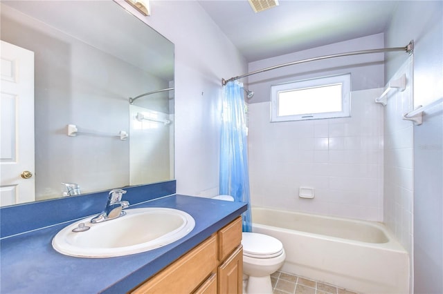 full bathroom featuring tile patterned floors, vanity, shower / bath combo, and toilet