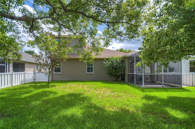 view of yard featuring a sunroom