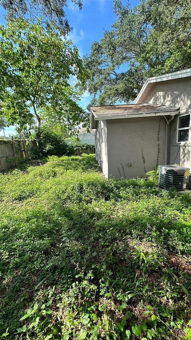 view of yard with central AC