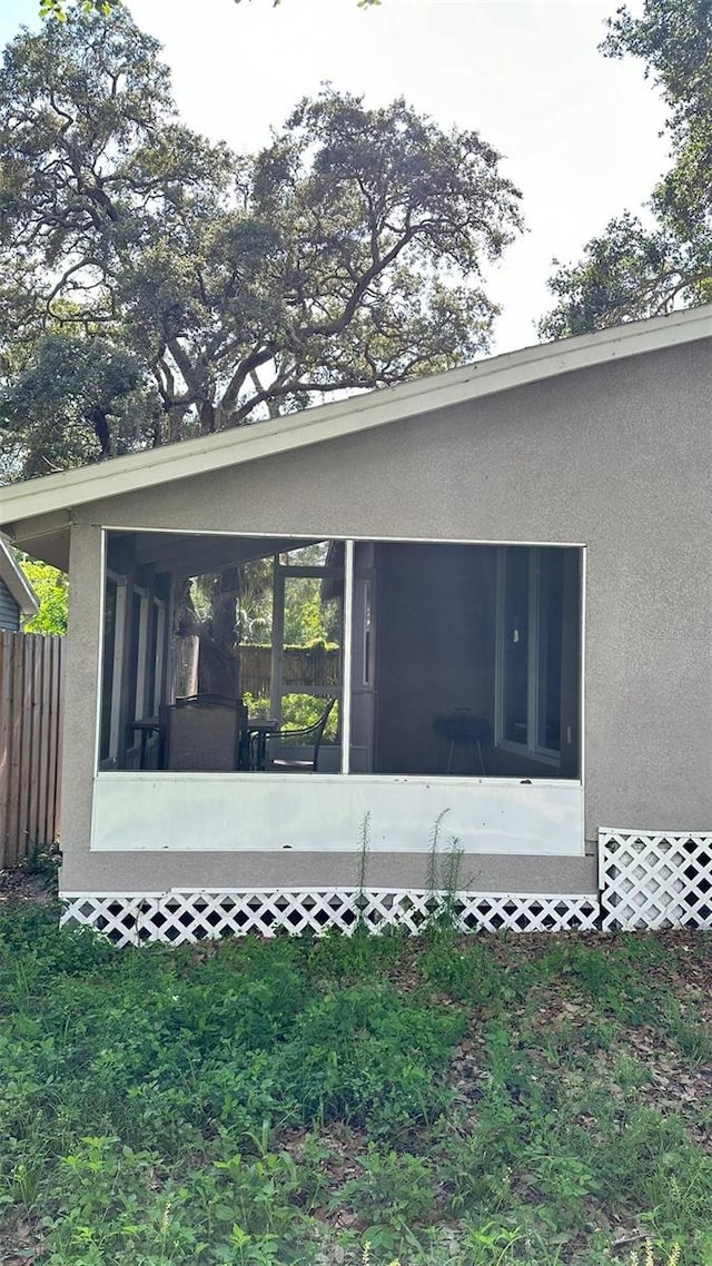 view of home's exterior featuring a sunroom