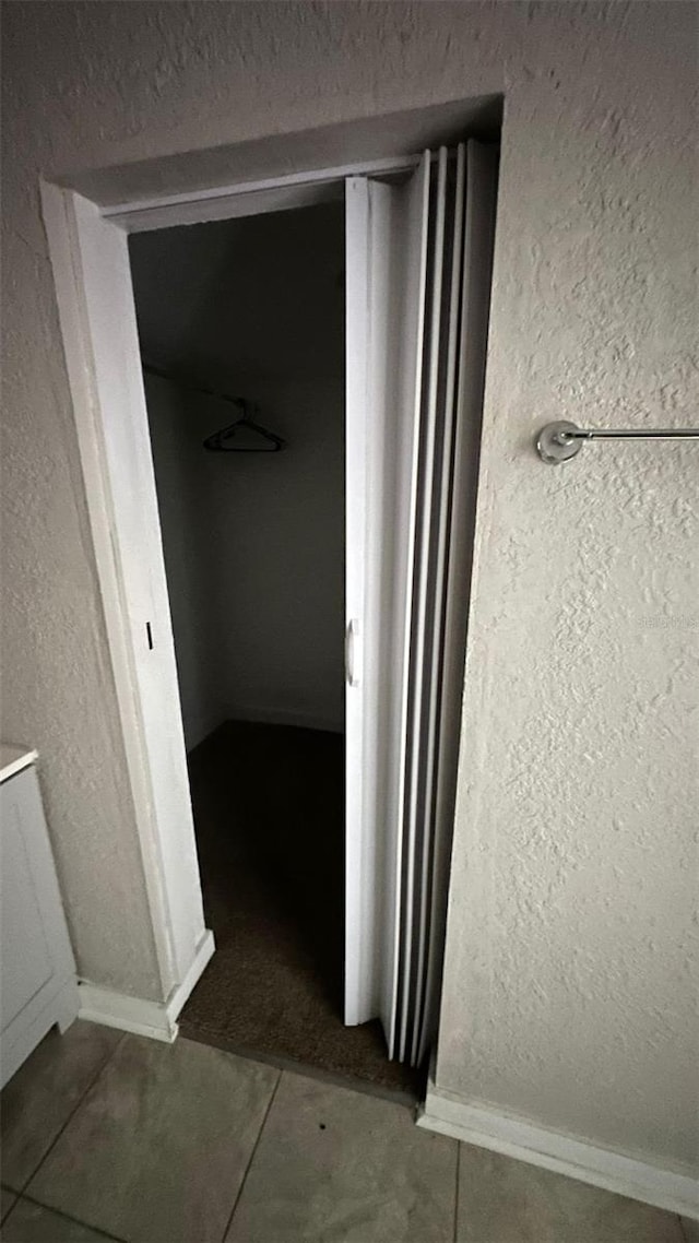 hall featuring tile patterned floors