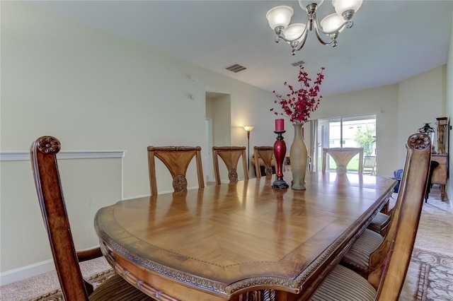 dining room with a notable chandelier