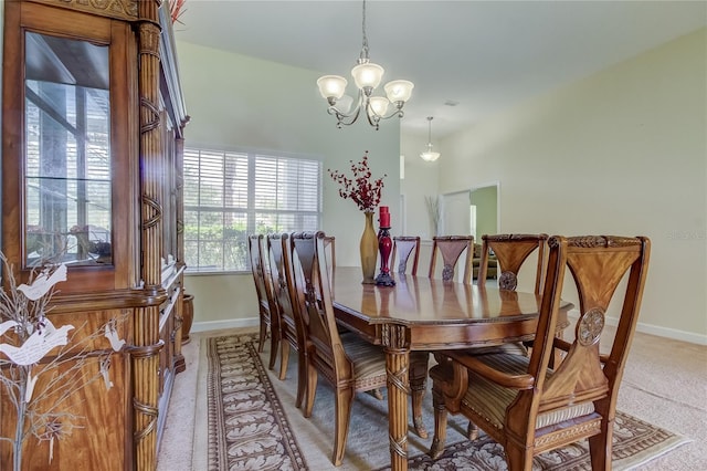 dining space featuring an inviting chandelier