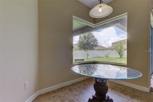 interior space featuring a wealth of natural light and light tile patterned floors