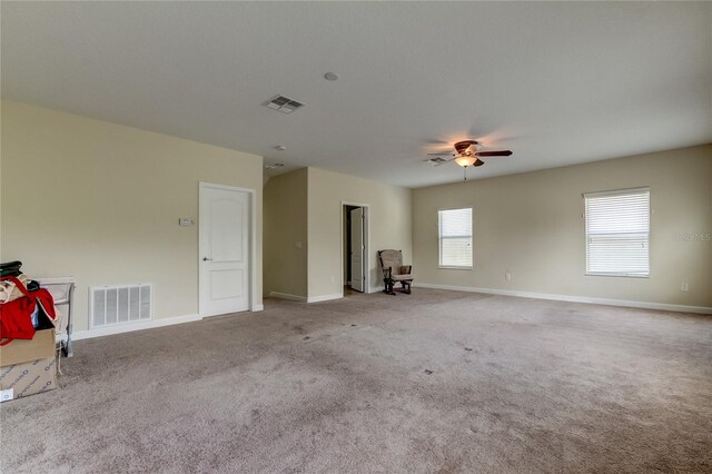 interior space with ceiling fan