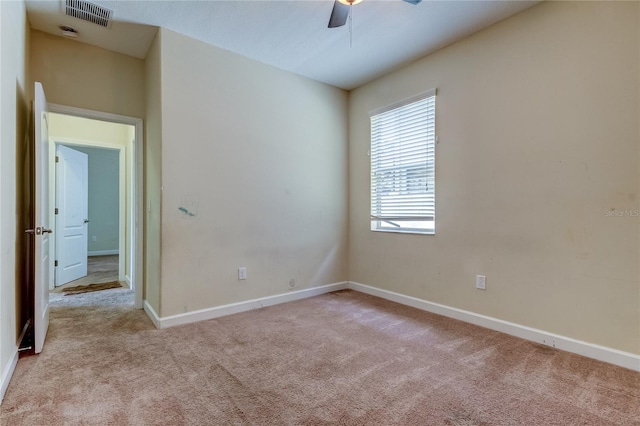 carpeted empty room with ceiling fan