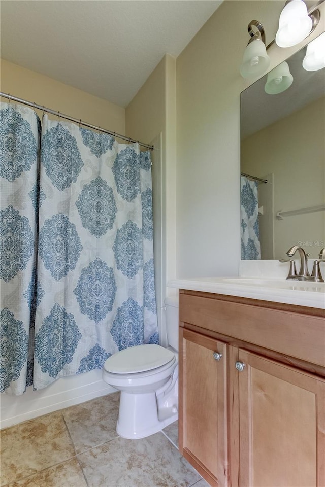 full bathroom featuring shower / bathtub combination with curtain, vanity, and toilet