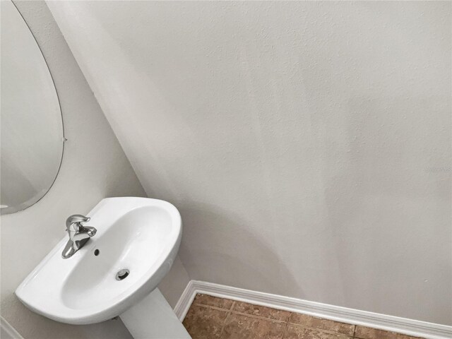 bathroom featuring tile floors and sink