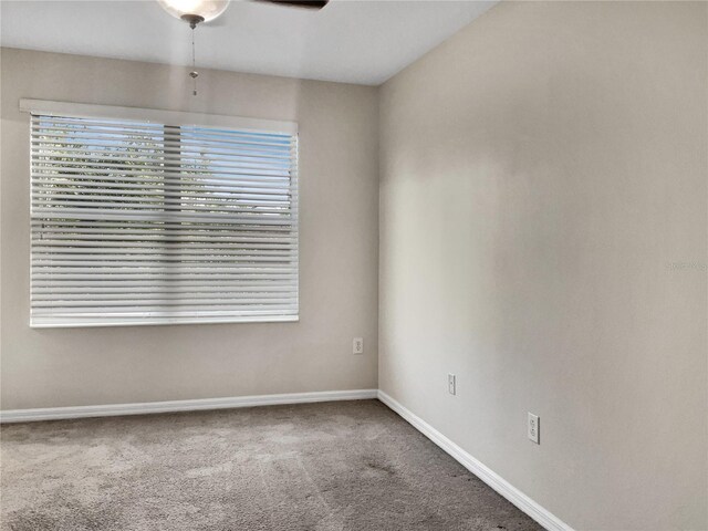 empty room with carpet flooring and ceiling fan