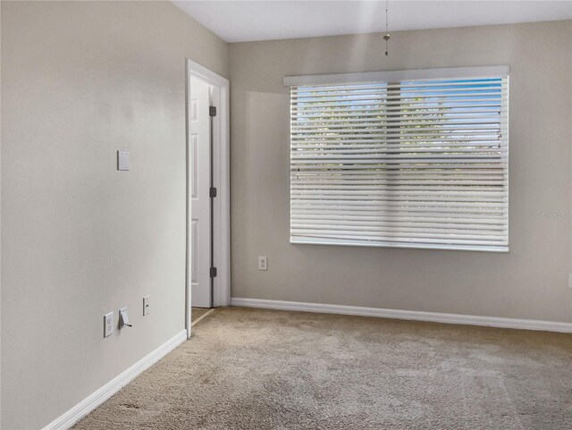 empty room featuring carpet flooring