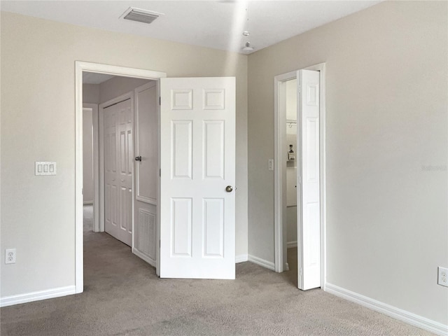 unfurnished bedroom with carpet flooring