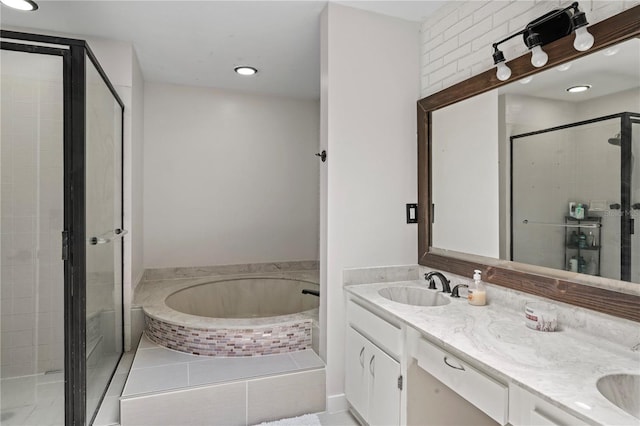 bathroom with independent shower and bath and vanity