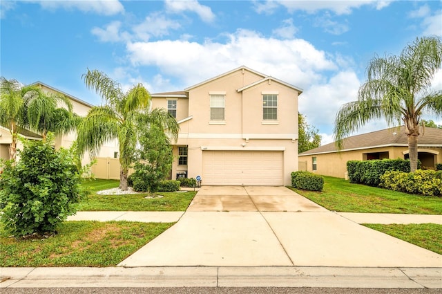 view of front of house with a garage and a front yard