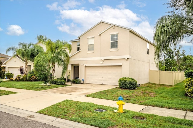 view of front of property with a garage and a front yard