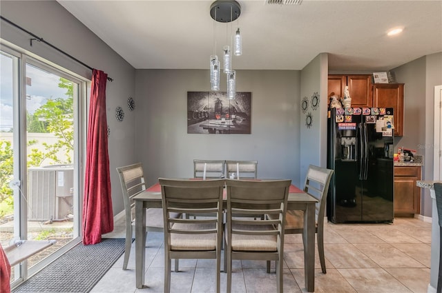 dining area with light tile patterned floors