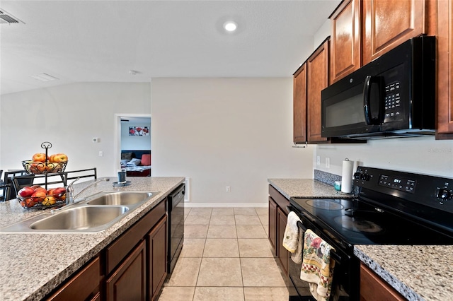 kitchen with black appliances, sink, and light tile flooring