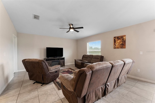 tiled living room with ceiling fan