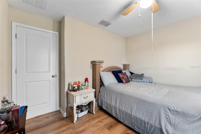 bedroom featuring wood-type flooring and ceiling fan