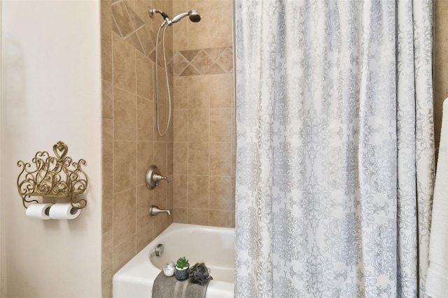 full bathroom with shower / bath combo with shower curtain