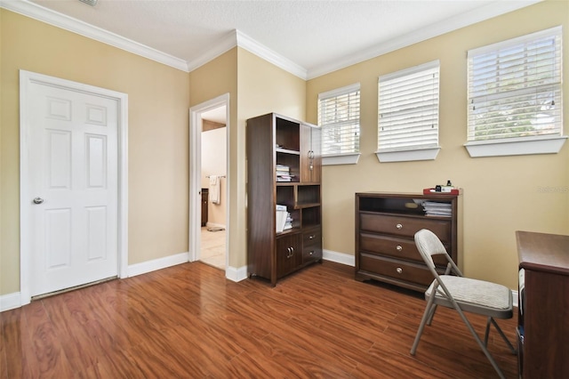 office with baseboards, ornamental molding, and wood finished floors