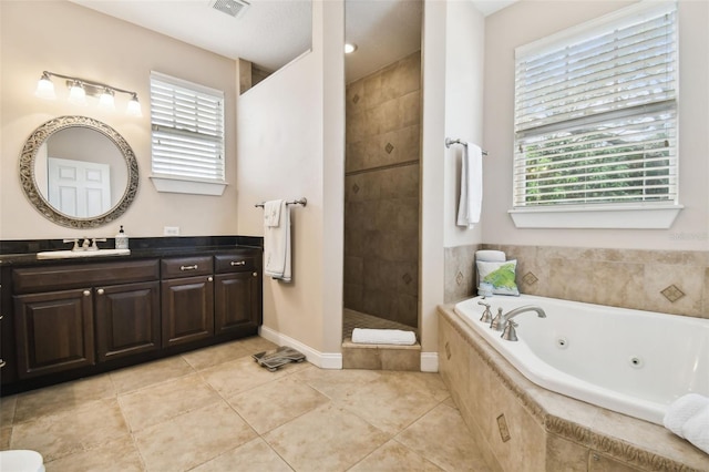 full bathroom with visible vents, a tub with jets, tile patterned flooring, vanity, and a walk in shower