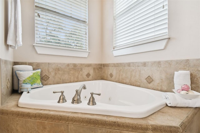 bathroom featuring a tub with jets