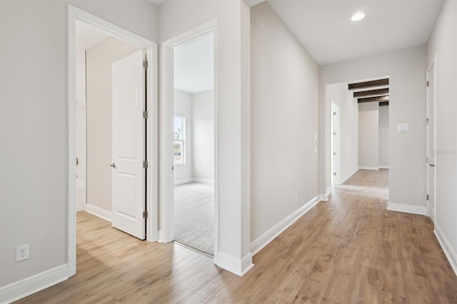 corridor featuring light hardwood / wood-style floors