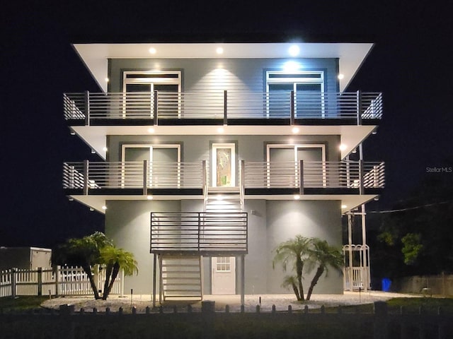 view of front of home with a balcony