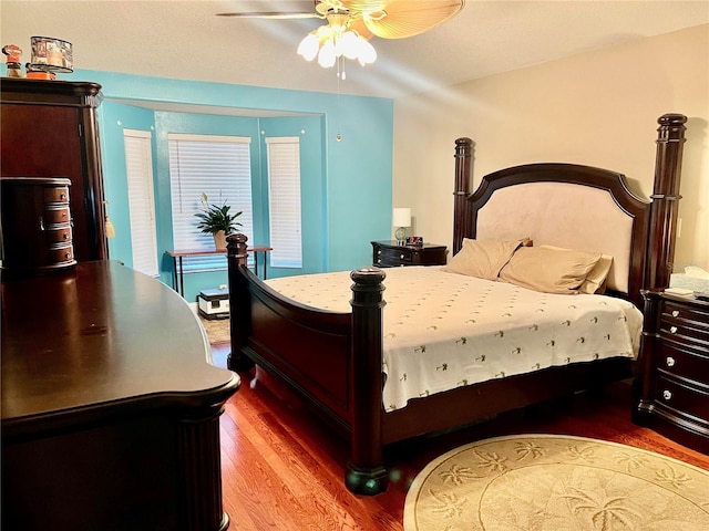 bedroom featuring hardwood / wood-style flooring and ceiling fan