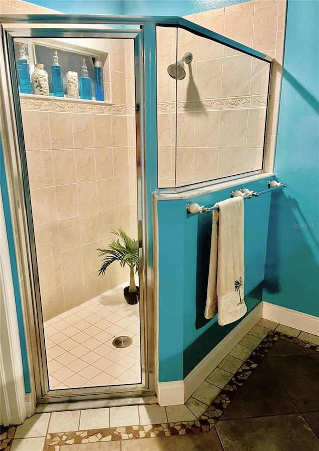 bathroom featuring tile patterned floors and an enclosed shower