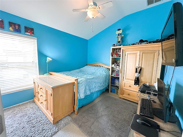 bedroom with ceiling fan, carpet, and vaulted ceiling