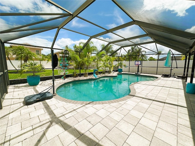 view of pool featuring a lanai and a patio area