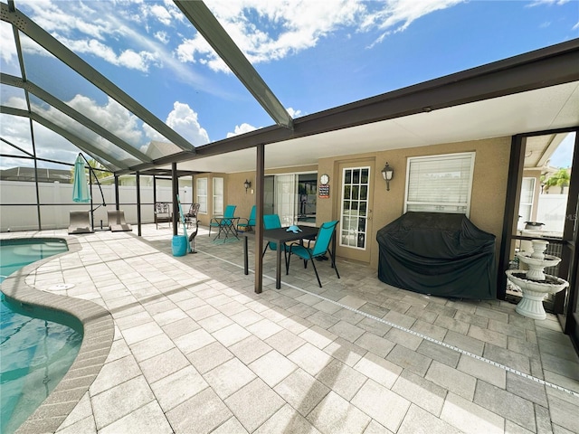 view of patio featuring a fenced in pool and a lanai