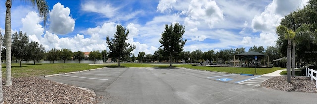 view of parking featuring a gazebo and a yard