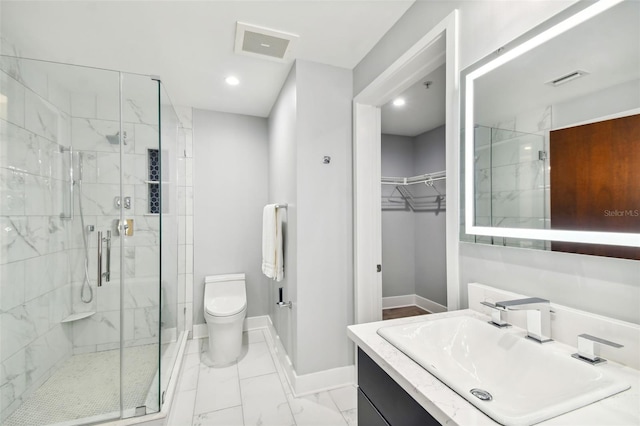 bathroom with tile patterned flooring, toilet, vanity, and walk in shower