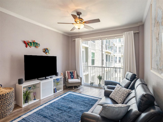 living room with crown molding, hardwood / wood-style flooring, and ceiling fan