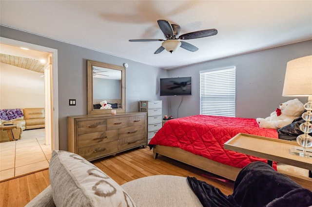 bedroom featuring ceiling fan and hardwood / wood-style flooring