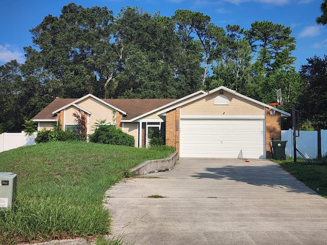 ranch-style home featuring a garage and a front yard