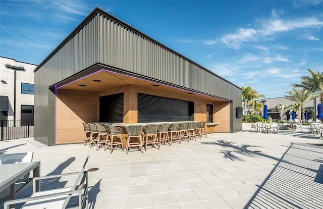 back of house with a patio