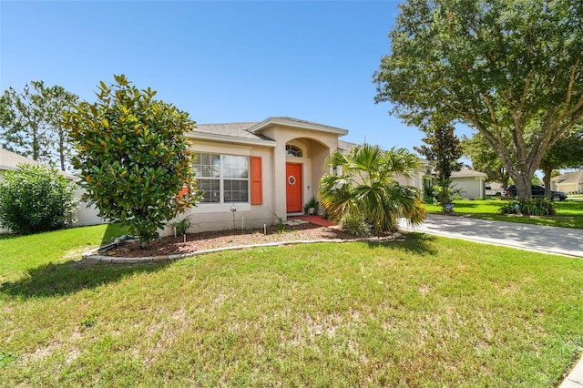 view of front of property with a front lawn