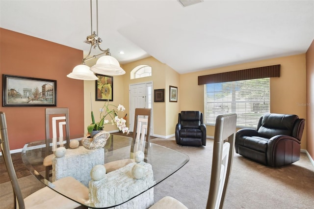 dining area with vaulted ceiling