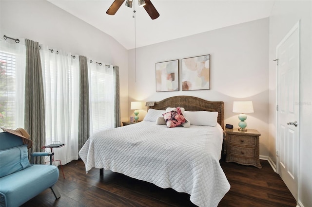 bedroom with lofted ceiling, dark hardwood / wood-style flooring, and ceiling fan