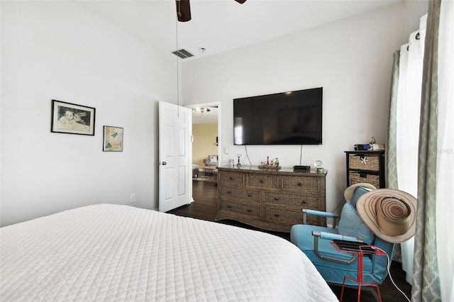 bedroom with dark hardwood / wood-style flooring, high vaulted ceiling, and ceiling fan