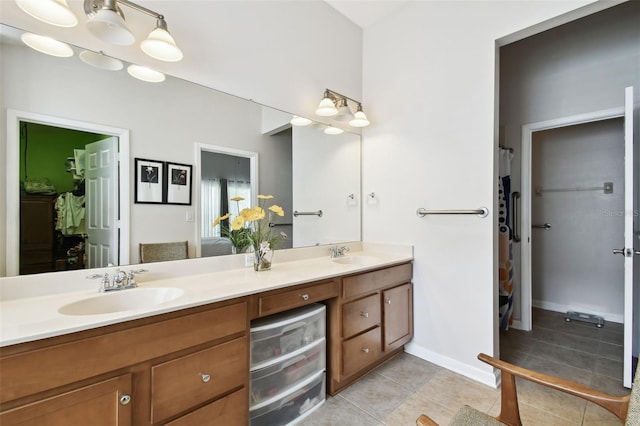 bathroom featuring dual vanity and tile patterned flooring