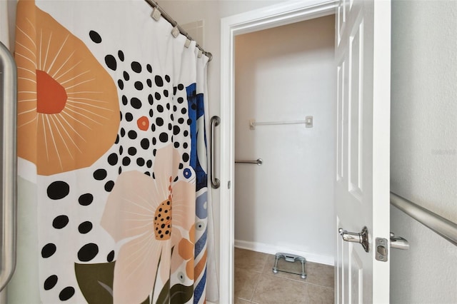 bathroom with tile patterned floors