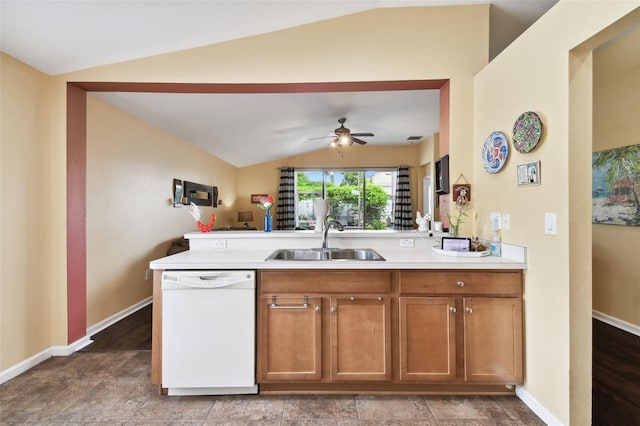 kitchen featuring wood-type flooring, ceiling fan, sink, white dishwasher, and lofted ceiling